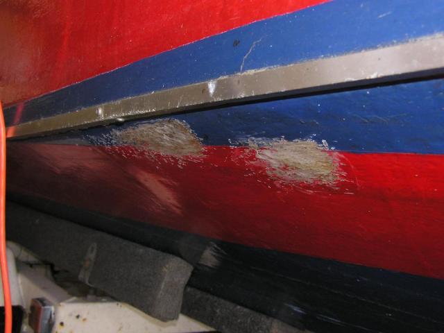 Repaired damage to fibreglass skin over plywood hull